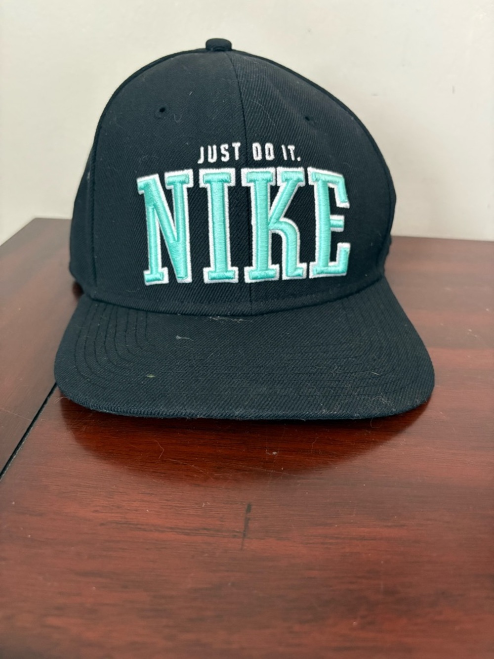 Nike Men’s Black SnapBack Hat With Teal Lettering Just Do it